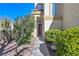 Inviting front entrance with a walkway bordered by lush greenery, enhancing curb appeal at 1712 Warrenville St, Las Vegas, NV 89117
