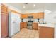 Well-lit kitchen showcasing stainless steel appliances and light wood cabinets at 1712 Warrenville St, Las Vegas, NV 89117