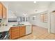 Open kitchen area featuring a breakfast bar, ample natural light, and modern appliances at 1712 Warrenville St, Las Vegas, NV 89117
