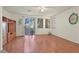 Bright living space with hardwood floors, patio access, and built-in shelving at 1712 Warrenville St, Las Vegas, NV 89117