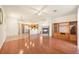 Expansive living area with hardwood floors, a fireplace, and a view of the open kitchen at 1712 Warrenville St, Las Vegas, NV 89117