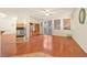 Spacious living room with hardwood floors, fireplace, and large windows at 1712 Warrenville St, Las Vegas, NV 89117