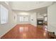 Spacious living room featuring hardwood floors, a fireplace, and large windows at 1712 Warrenville St, Las Vegas, NV 89117