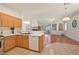 Open-concept kitchen and living room with modern appliances and fireplace at 1712 Warrenville St, Las Vegas, NV 89117