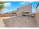 Backyard with fresh dirt, patio slider, and partially fenced yard. Ready for your custom landscaping at 1836 Soto Ln, North Las Vegas, NV 89032