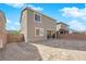 Wide view of the backyard with fresh dirt, block wall, and patio area ready for your custom design at 1836 Soto Ln, North Las Vegas, NV 89032