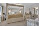 Elegant main bedroom showcasing a four-poster bed, dresser, and neutral tones at 1836 Soto Ln, North Las Vegas, NV 89032