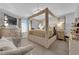 Beautiful main bedroom featuring a four-poster bed, natural light, and a dresser at 1836 Soto Ln, North Las Vegas, NV 89032