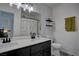 The bathroom features a dual sink vanity, lots of light, and a shower/tub combo at 1847 Avacado Ct, Henderson, NV 89014