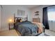 Cozy bedroom featuring a comfortable bed with a decorative headboard and wooden dresser at 1847 Avacado Ct, Henderson, NV 89014