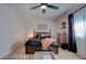 Comfortable bedroom features stylish dark accents, lots of light, and a decorative dresser at 1847 Avacado Ct, Henderson, NV 89014