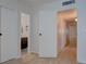 Bright hallway with multiple doors, leading to different rooms within the house at 1847 Avacado Ct, Henderson, NV 89014