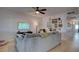 Inviting living room featuring a large gray sofa, decor, and light wood floors at 1847 Avacado Ct, Henderson, NV 89014