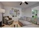 Inviting living room features a comfortable gray sofa, accent chair, and gallery wall at 1847 Avacado Ct, Henderson, NV 89014