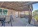 Spacious outdoor patio area with a pergola, dining table, and wrought iron fencing at 1847 Avacado Ct, Henderson, NV 89014