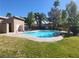 Gorgeous community pool surrounded by lush landscaping and blue skies at 1847 Avacado Ct, Henderson, NV 89014