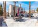 Spacious backyard patio with pool, outdoor dining set, shed, and palm trees at 2042 Waverly Cir, Henderson, NV 89014