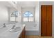Bright bathroom featuring a large vanity and natural lighting at 2042 Waverly Cir, Henderson, NV 89014