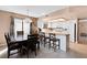 Bright dining area with tile flooring, adjacent to an open kitchen and featuring backyard views, perfect for Gathering gatherings at 2042 Waverly Cir, Henderson, NV 89014
