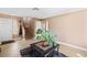 Inviting entryway showcasing neutral tones, tile flooring, stairs, and a stylish plant that enhances the aesthetic appeal at 2042 Waverly Cir, Henderson, NV 89014