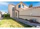 Charming home exterior showcasing a well-manicured lawn and inviting front entrance with beautiful desert landscaping at 2042 Waverly Cir, Henderson, NV 89014