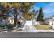 Charming home featuring a well-maintained garage, complemented by a landscaped yard and a mature tree in a sunny location at 2042 Waverly Cir, Henderson, NV 89014