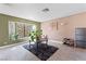 Comfortable living space with tile floors and large bay window, offering natural light and a relaxing atmosphere at 2042 Waverly Cir, Henderson, NV 89014