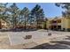 Sand volleyball court surrounded by mature landscaping and trees at 2120 Ramrod Ave # 415, Henderson, NV 89014