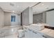 Stylish bathroom featuring a modern vanity, a bathtub-shower combo, and tile accents at 222 Karen Ave # 1904, Las Vegas, NV 89109