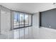 Modern bedroom featuring sliding glass doors to balcony with city views and marble floors at 222 Karen Ave # 1904, Las Vegas, NV 89109