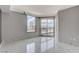 Bright bedroom featuring city views from large windows with marble tile flooring throughout at 222 Karen Ave # 1904, Las Vegas, NV 89109