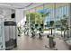 Well-equipped gym with cardio machines and floor-to-ceiling windows overlooking the pool at 222 Karen Ave # 1904, Las Vegas, NV 89109