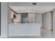 A kitchen with white countertops, appliances and backsplash with accenting gray cabinets at 222 Karen Ave # 1904, Las Vegas, NV 89109