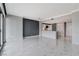 Spacious living room, marble tile floors, gray accent wall, and sliding glass doors to balcony at 222 Karen Ave # 1904, Las Vegas, NV 89109