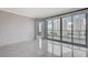 Living room featuring tile floors, neutral paint, and sliding glass doors to balcony at 222 Karen Ave # 1904, Las Vegas, NV 89109