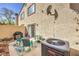 Outdoor patio with furniture set, grill and potted plants, enhanced by a sunny sky at 2609 Orchard Meadows Ave, Henderson, NV 89074