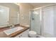 Cozy bathroom with a vanity, granite countertop, and a walk-in shower with glass doors at 2609 Orchard Meadows Ave, Henderson, NV 89074