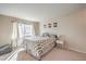 Cozy bedroom with a window providing natural light and a calming neutral color scheme at 2609 Orchard Meadows Ave, Henderson, NV 89074