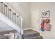 Inviting entryway with tiled floor, staircase, and coat rack, creating a welcoming first impression at 2609 Orchard Meadows Ave, Henderson, NV 89074