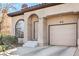 Charming exterior view of a home featuring an attached one-car garage and well-maintained landscaping at 2609 Orchard Meadows Ave, Henderson, NV 89074
