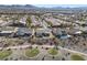 Aerial view of a single-story home with a small backyard pool and a golf course behind it at 2920 Foxtail Creek Ave, Henderson, NV 89052