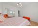 Bedroom featuring an orange bed set and a mirrored closet at 2920 Foxtail Creek Ave, Henderson, NV 89052