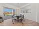 Bright dining area with backyard view featuring a glass table and a sliding glass door at 2920 Foxtail Creek Ave, Henderson, NV 89052