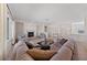 Spacious living room with a fireplace, tile floors, and comfortable seating arrangements at 2920 Foxtail Creek Ave, Henderson, NV 89052