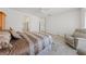 Large main bedroom features a comfortable chair, natural light, and tiled floors at 2920 Foxtail Creek Ave, Henderson, NV 89052