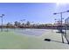 Well-maintained community tennis courts for recreational play and exercise with lighting for nighttime play at 2920 Foxtail Creek Ave, Henderson, NV 89052