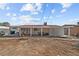 Backyard with a covered patio, seating area, and well defined landscaped areas at 2963 Greendale St, Las Vegas, NV 89121