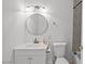 Bathroom with a white vanity, mirror, and toilet at 2963 Greendale St, Las Vegas, NV 89121