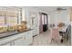 Light-filled dining room with stylish furniture and white tile floors at 2963 Greendale St, Las Vegas, NV 89121
