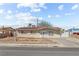 Charming single-story home featuring a red tile roof, secure window bars, and a well-maintained concrete driveway at 2963 Greendale St, Las Vegas, NV 89121
